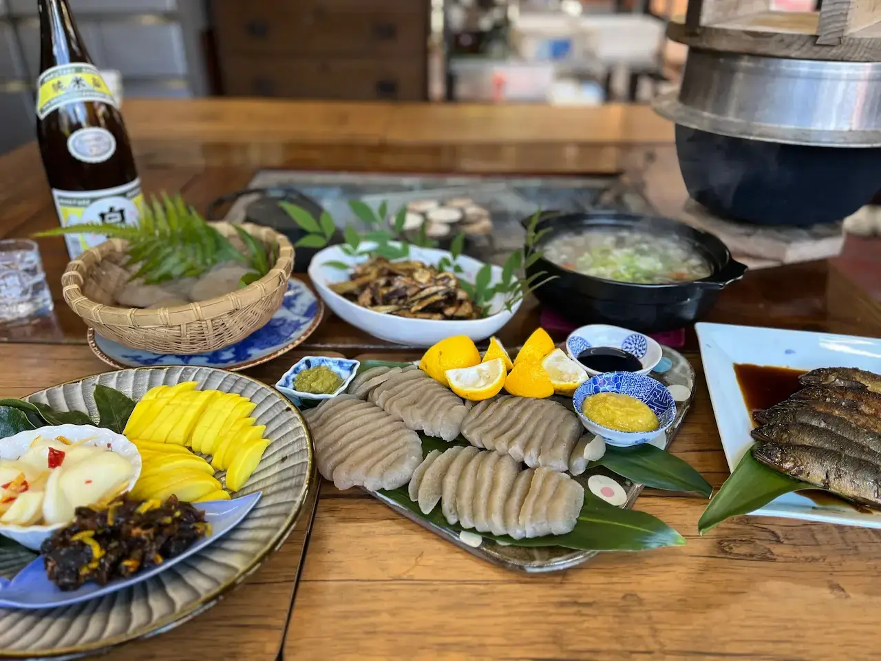A spread of traditional Japanese foods served with yuzu lemon