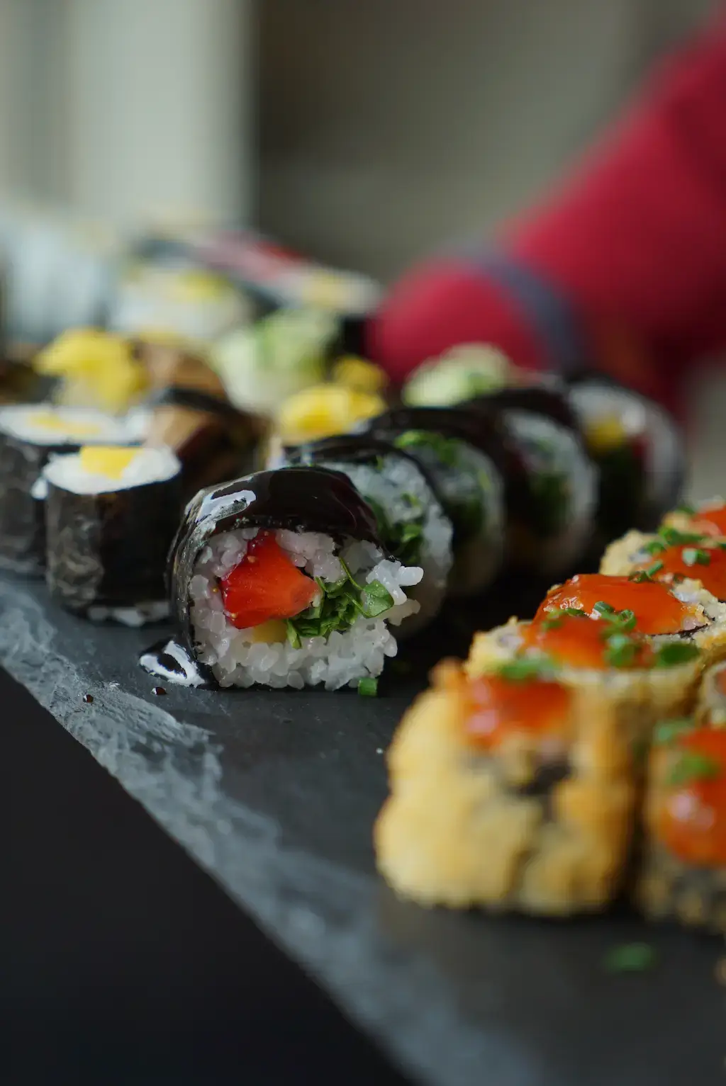 A plate displaying various sushi rolls